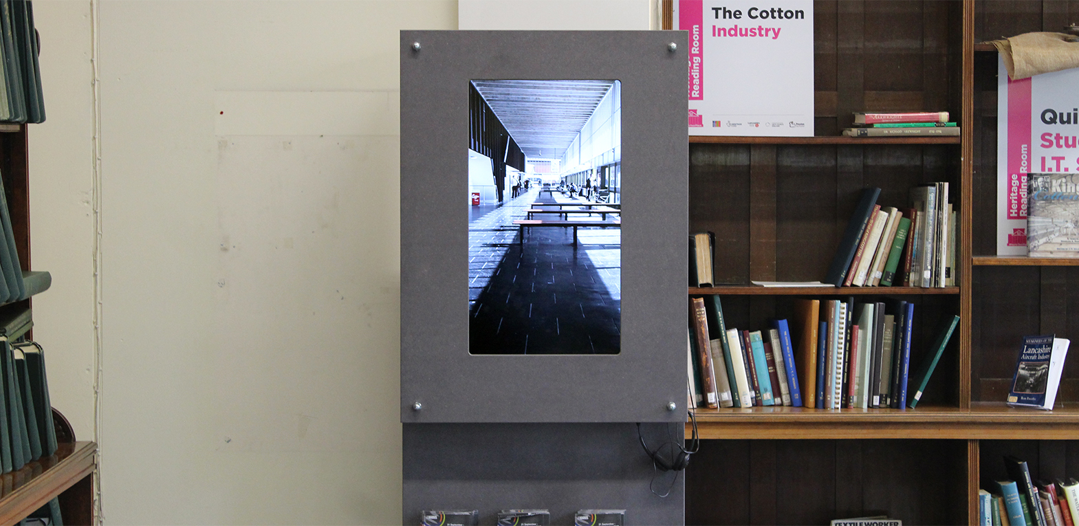 Anna Raczynski's film 'Portraits of a Bus Station' installed on portrait oriented screens throughout the Beautiful and Brutal exhibition.