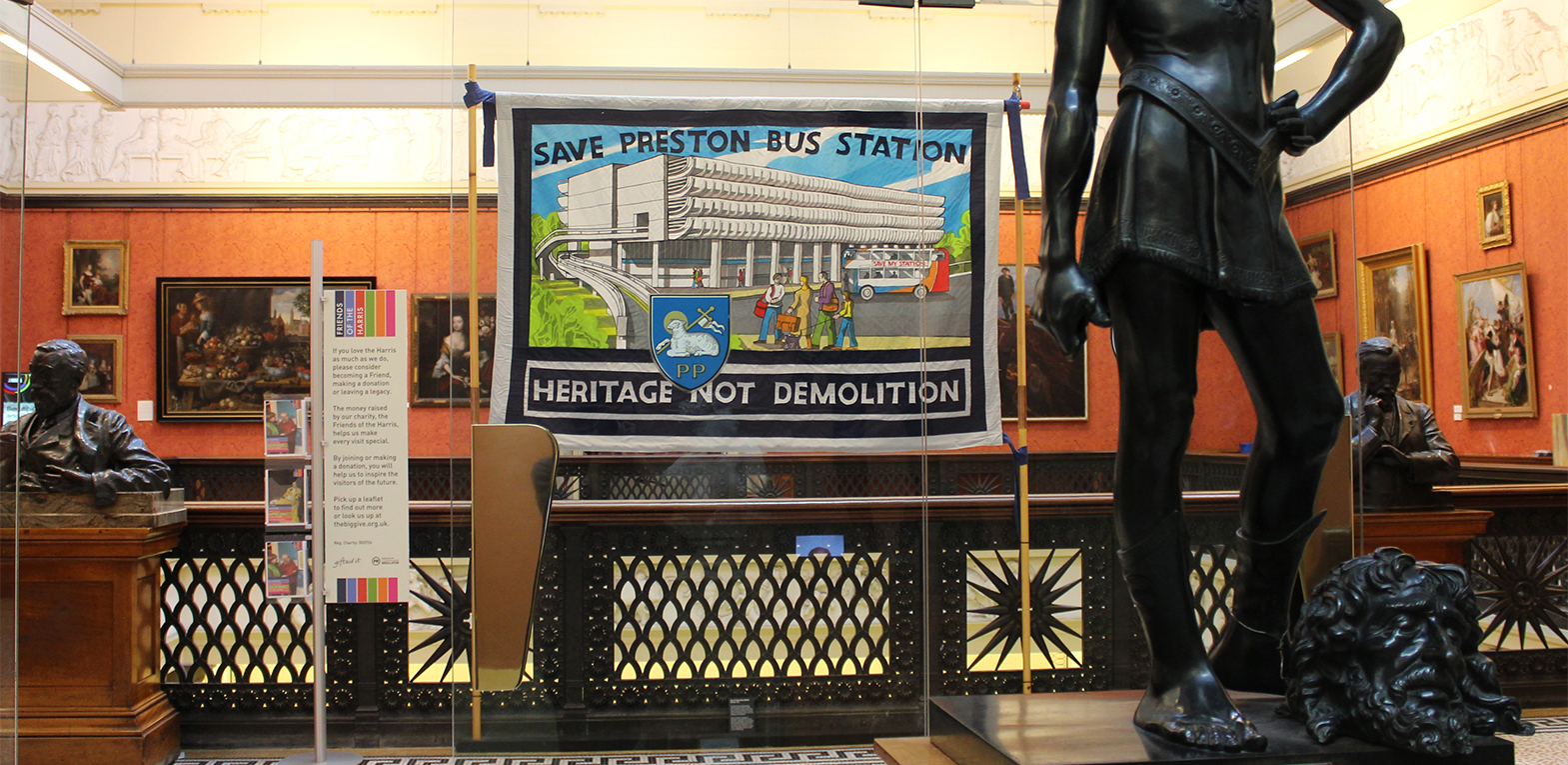 The exhibition in the Harris Museum. A handstitched 'Save Preston Bus Station' banner displayed on the 2nd floor landing.
