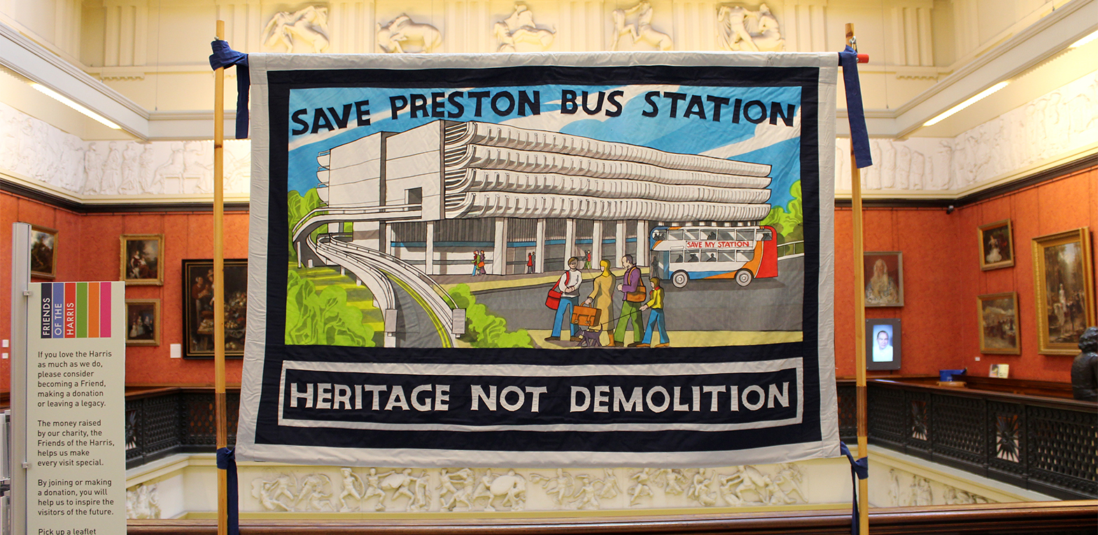 The exhibition in the Harris Museum. A handstitched 'Save Preston Bus Station' banner displayed on the 2nd floor landing.