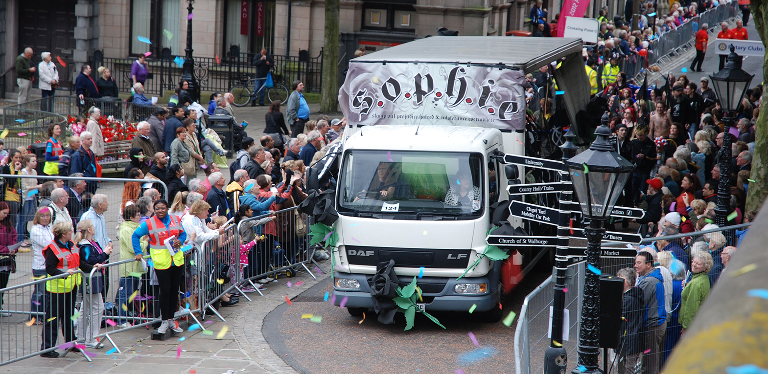 The Black Parade as part of Preston Guild 2012. A crowd follow a float.