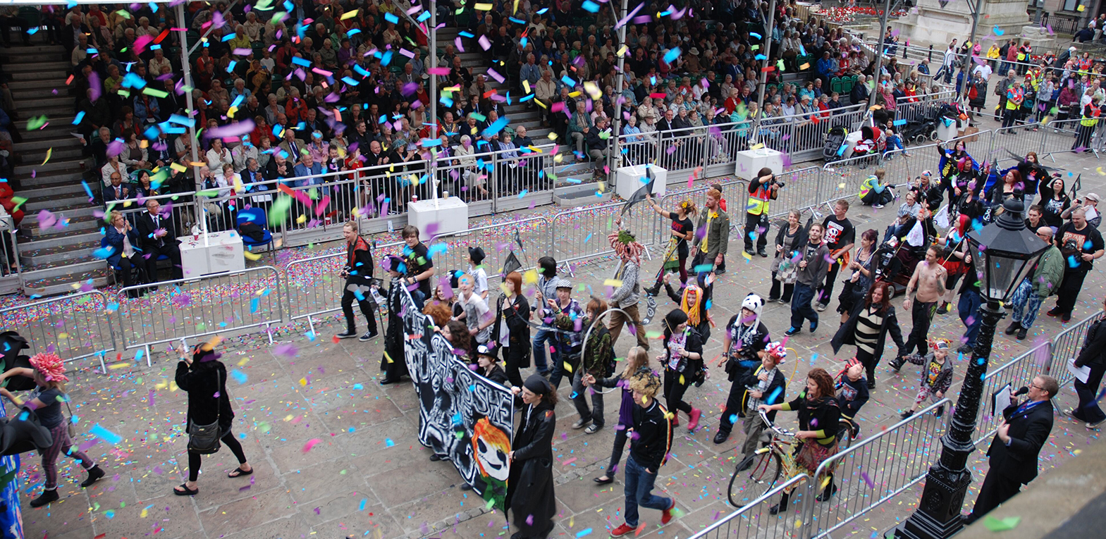 The Black Parade as part of Preston Guild 2012. A crowd follow a float.
