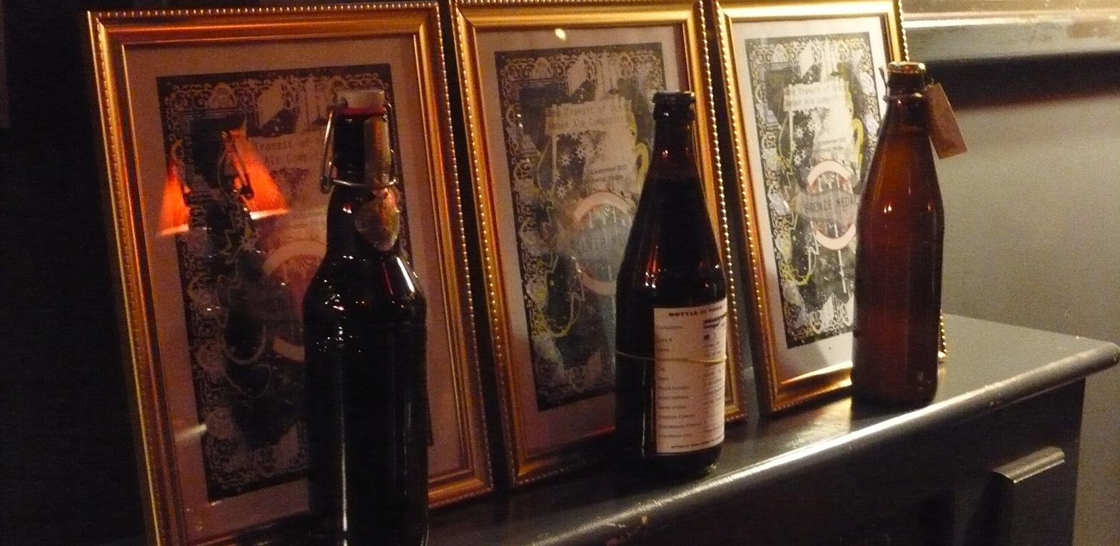 3 beer bottles on a sideboard
